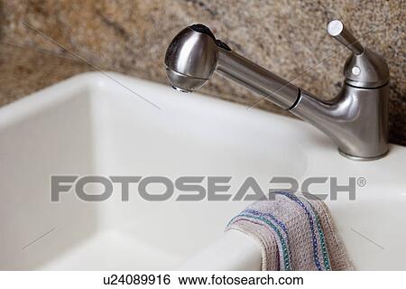 Kitchen faucet above double sink; Burbank; California; USA View Large Photo Image Stock Photograph - Kitchen faucet above double sink; Burbank; California; USA. Fotosearch