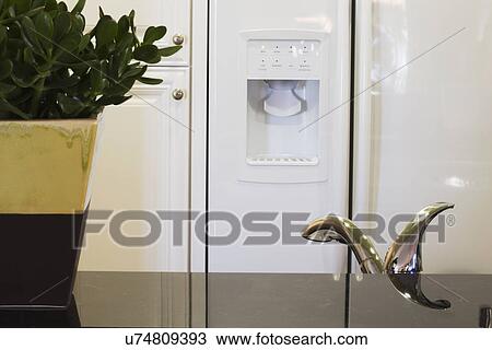 Kitchen faucet in front of refrigerator; Aliso Viejo; California; USA View Large Photo Image Stock Image - Kitchen faucet in front of refrigerator; Aliso Viejo; California; USA. Fotosearch