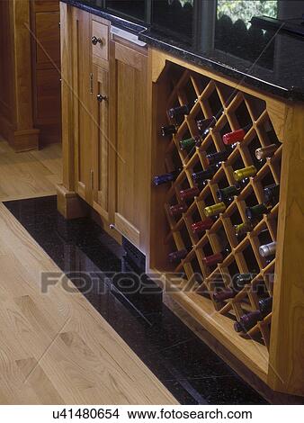 KITCHENS - Detail of under counter wine storage, wood floor with inset of black marble tile that runs along base of counter, modern mission style View Large Photo Image Picture - KITCHENS - Detail of under counter wine storage, wood floor with inset of black marble tile that runs along base of counter, modern mission style . Fotosearch