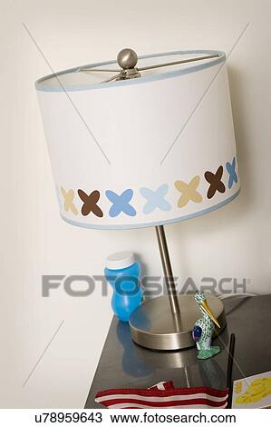 Stock Image - Lamp on nightstand, San Diego, California, USA. Fotosearch