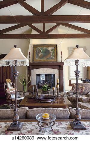 Stock Photo - Lamps on end table in traditional living room, at Laguna Beach, California, USA. Fotosearch