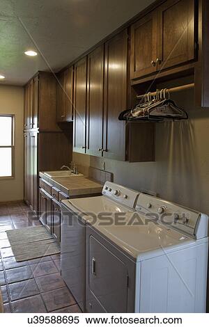 Laundry room in traditional home; Porterville; California; USA View Large Photo Image Stock Photography - Laundry room in traditional home; Porterville; California; USA. Fotosearch