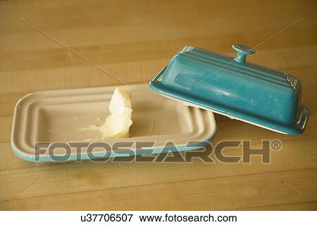 Stock Photo - Leftover butter in butter dish; Carpinteria; California; USA. Fotosearch