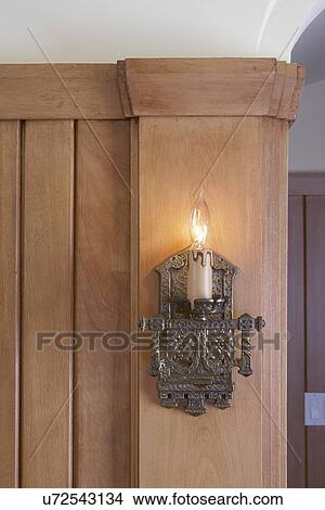Lighting fixtures: Arts and Crafts style wall sconce. Light wood walls, exposed blub. View Large Photo Image Picture - Lighting fixtures: Arts and Crafts style wall sconce. Light wood walls, exposed blub.. Fotosearch
