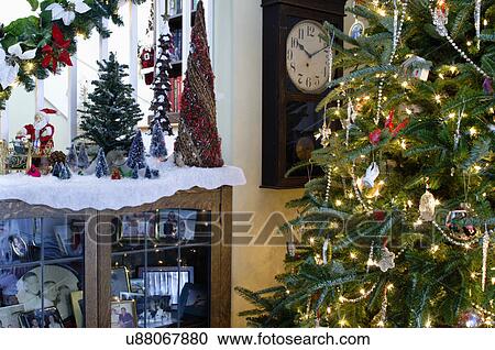 Stock Image - Lit Christmas tree and decorations. Fotosearch