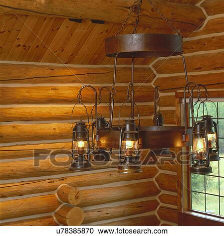 Lit lanterns hanging on circular metal frame with wooden ceiling and walls View Large Photo Image Stock Image - Lit lanterns hanging on circular metal frame with wooden ceiling and walls. Fotosearch
