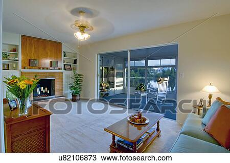 Living room and sunroom in traditional home View Large Photo Image Stock Image - Living room and sunroom in traditional home. Fotosearch