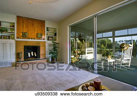 Living room and sunroom in traditional home View Large Photo Image Stock Photo - Living room and sunroom in traditional home. Fotosearch