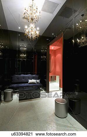 Stock Image - Lounge area with crystal chandelier. Fotosearch