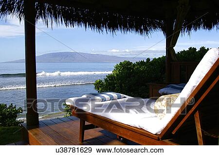 Lounge chair on deck overlooking ocean, USA, Hawaii, Maui View Large Photo Image Stock Photo - Lounge chair on deck overlooking ocean, USA, Hawaii, Maui. Fotosearch