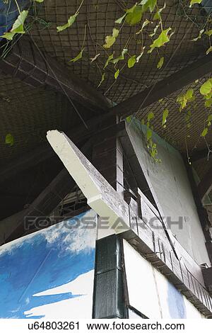 Stock Image - Low angle view of ceiling covered with fishing nets. Fotosearch