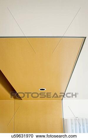 Stock Image - Low angle view of ceiling with recessed light, San Diego, California, USA. Fotosearch