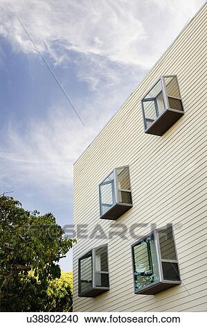 Stock Image - Low angle view of modern bay windows on side of home, San Diego, California, USA. Fotosearch