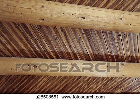 Stock Image - Low angle view of roof beam, USA, New Mexico, Santa Fe. Fotosearch