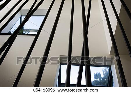 Stock Photography - Low angle view railing along modern staircase, San Diego, California, USA. Fotosearch