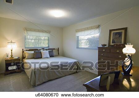 Stock Image - Master bedroom in traditional home. Fotosearch