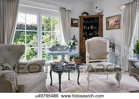 Mismatched armchairs in traditional living room View Large Photo Image Stock Photograph - Mismatched armchairs in traditional living room. Fotosearch