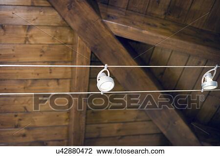 Modern track light along hardwood ceiling; Italy View Large Photo Image Stock Image - Modern track light along hardwood ceiling; Italy. Fotosearch
