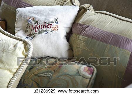 Mother's throw pillow on sofa; Carpinteria; California; USA View Large Photo Image Stock Photo - Mother's throw pillow on sofa; Carpinteria; California; USA. Fotosearch
