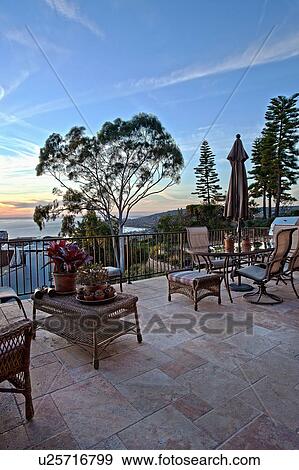 Ocean view from patio at sunset, Laguna Beach, California, USA View Large Photo Image Stock Photo - Ocean view from patio at sunset, Laguna Beach, California, USA. Fotosearch