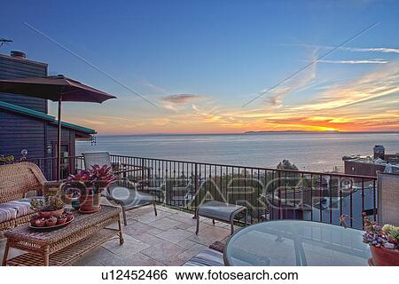 Stock Photograph - Ocean view patio at sunset, Laguna Beach, California, USA. Fotosearch
