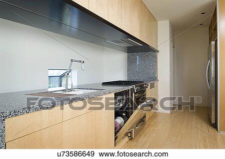 Open door of storage compartment in modern kitchen, San Diego, California, USA View Large Photo Image Stock Photo - Open door of storage compartment in modern kitchen, San Diego, California, USA. Fotosearch
