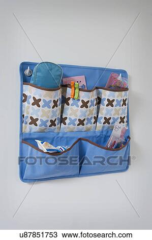 Organization pouches hanging on wall View Large Photo Image Stock Image - Organization pouches hanging on wall. Fotosearch
