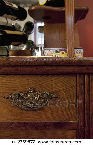 Ornate handle on wooden drawer; Seal Beach; California; USA View Large Photo Image Stock Image - Ornate handle on wooden drawer; Seal Beach; California; USA. Fotosearch