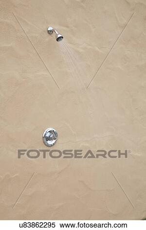 Stock Photography - Outdoor shower with running water; Bakersfield; California; USA. Fotosearch