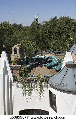 Stock Photo - PATIO AREA: rooftop deck/ patio, dining area, chaise lounges, built in planter boxes vertical upper deck. Fotosearch