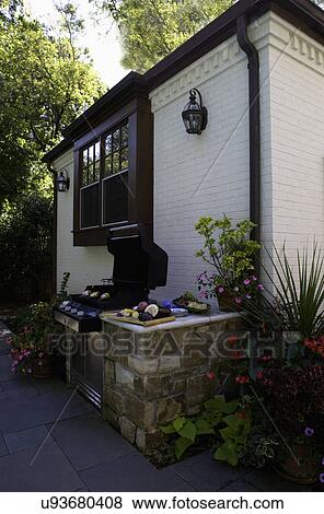 Patio Close Up Of Barbeque White Brick House Open Grill Stock