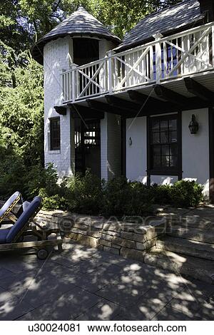 PATIO: French Normandy style pool house, turret holds stairway to upper balcony, View Large Photo Image Stock Image - PATIO: French Normandy style pool house, turret holds stairway to upper balcony,. Fotosearch
