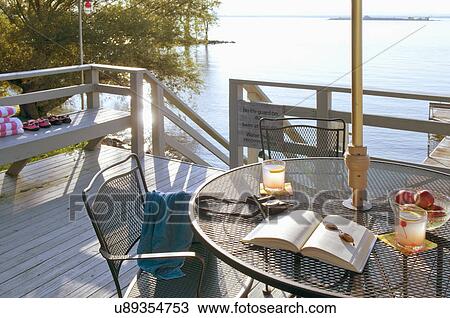 Patio table on deck by lake View Large Photo Image Stock Image - Patio table on deck by lake. Fotosearch