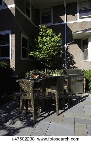 PATIOS: built in bar area with gas grill, patio, stucco home View Large Photo Image Stock Photo - PATIOS: built in bar area with gas grill, patio, stucco home. Fotosearch