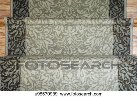 Stock Photo - Patterned carpet runner on staircase; Potomac; Maryland; USA. Fotosearch