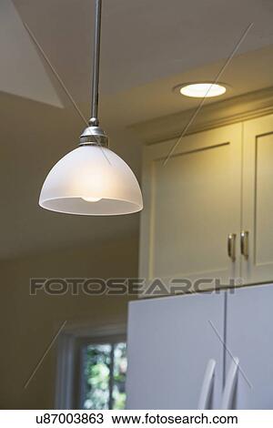 Stock Image - Pendant light in kitchen. Fotosearch