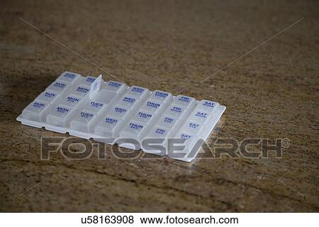 Pill box on countertop; Porterville; California; USA View Large Photo Image Stock Photo - Pill box on countertop; Porterville; California; USA. Fotosearch