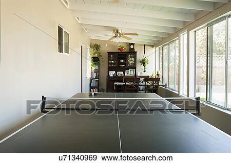 Stock Photo - Ping pong table in sunroom of home, San Diego, California, United States of America. Fotosearch