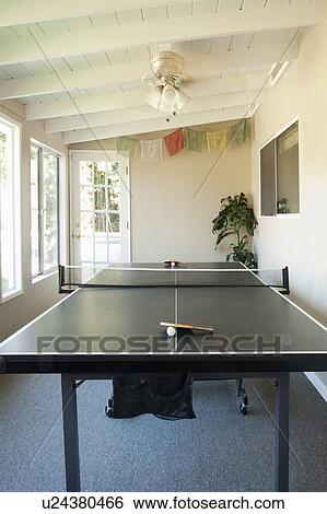 Stock Photograph - Ping pong table in sunroom of home, San Diego, California, United States of America. Fotosearch