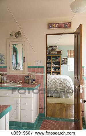 Pink and blue tiled bathroom between bedrooms; Carpinteria; California; USA View Large Photo Image Stock Photo - Pink and blue tiled bathroom between bedrooms; Carpinteria; California; USA. Fotosearch
