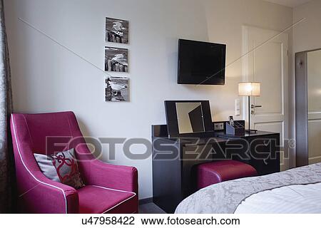 Pink armchair by dressing table in bedroom View Large Photo Image Stock Image - Pink armchair by dressing table in bedroom. Fotosearch