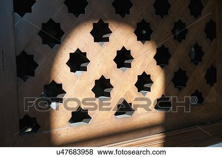 Stock Photo - Pointed star pattern on wooden window covering; Irvine; California; USA. Fotosearch