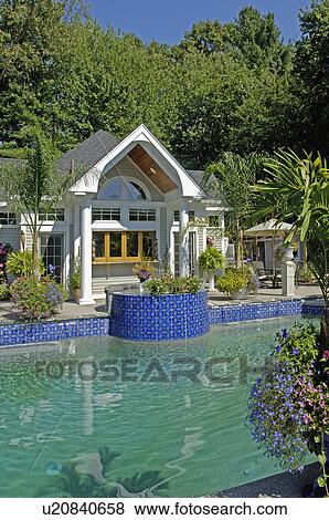 Stock Photo - Pool house by swimming pool. Fotosearch