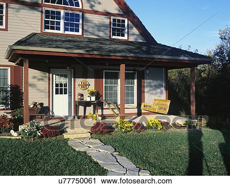 PORCH: country home with fall mums surrounding porch, porch swing, pumpkins View Large Photo Image Stock Image - PORCH: country home with fall mums surrounding porch, porch swing, pumpkins. Fotosearch