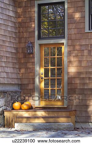 Pumpkins on front stairs of closed door View Large Photo Image Stock Image - Pumpkins on front stairs of closed door. Fotosearch
