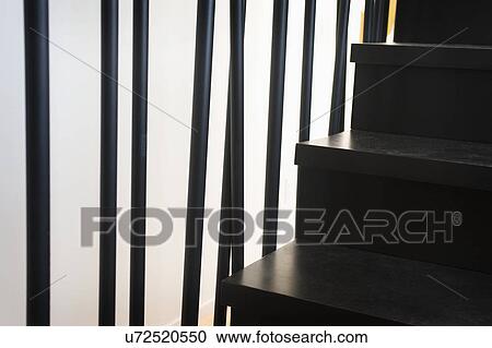 Stock Image - Railing along modern staircase, San Diego, California, USA. Fotosearch