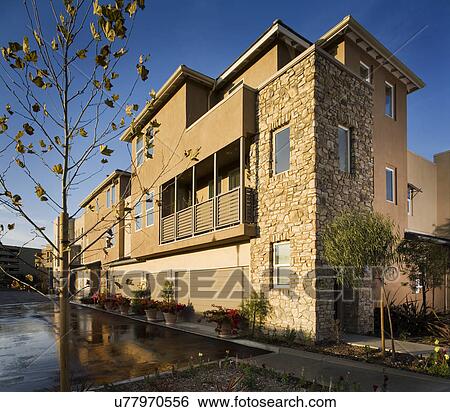 Stock Photograph - Rear of contemporary townhomes and garages; Aliso Viejo; California; USA. Fotosearch