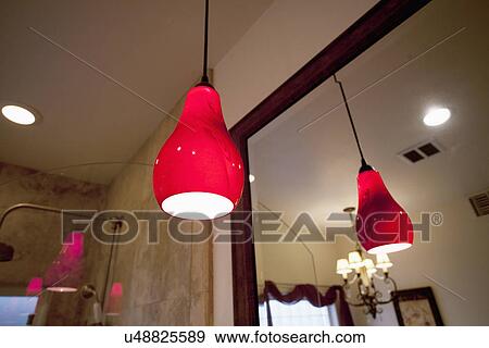 Red pendant light hanging in bathroom; Seal Beach; California; USA View Large Photo Image Stock Photo - Red pendant light hanging in bathroom; Seal Beach; California; USA. Fotosearch