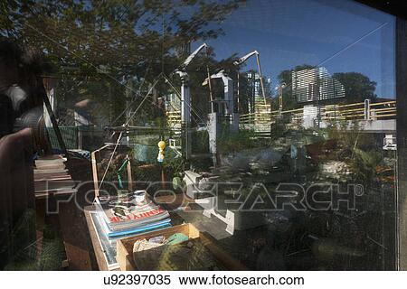 Reflected window glass with magazine stack on table View Large Photo Image Stock Photography - Reflected window glass with magazine stack on table. Fotosearch