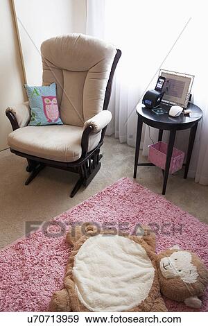 Rocking chair in baby nursery, Laguna Beach, California, USA View Large Photo Image Stock Photo - Rocking chair in baby nursery, Laguna Beach, California, USA. Fotosearch